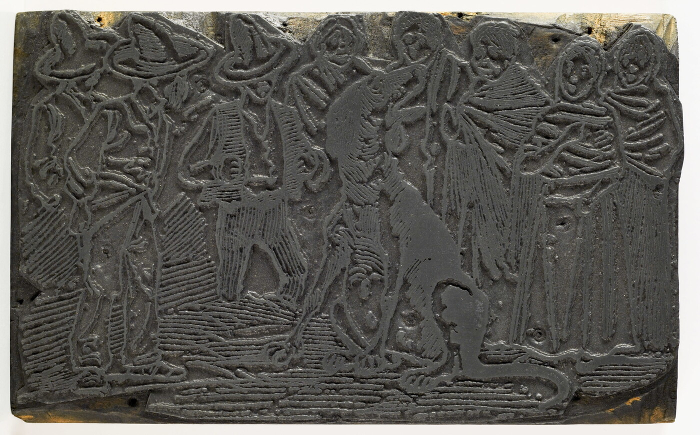 An engraved metal printing plate of an illustration of a group of people standing around a very large, sitting dog.