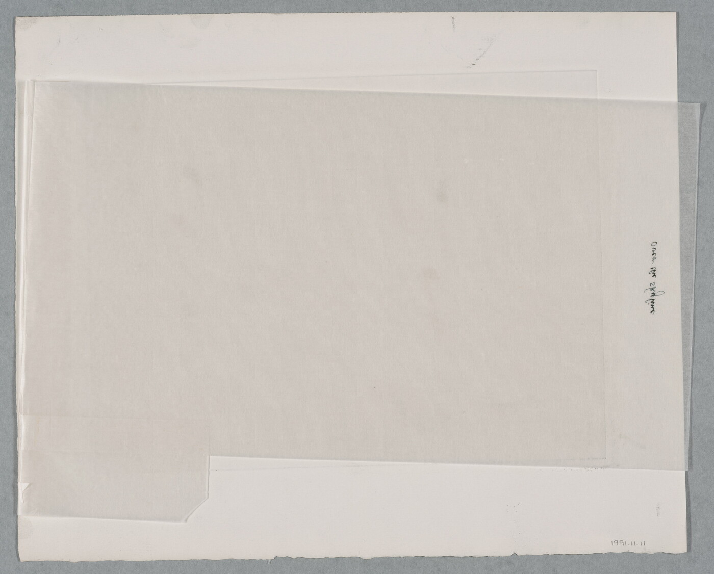 A black-and-white print of abstract planets and star-shapes over a city skyline.