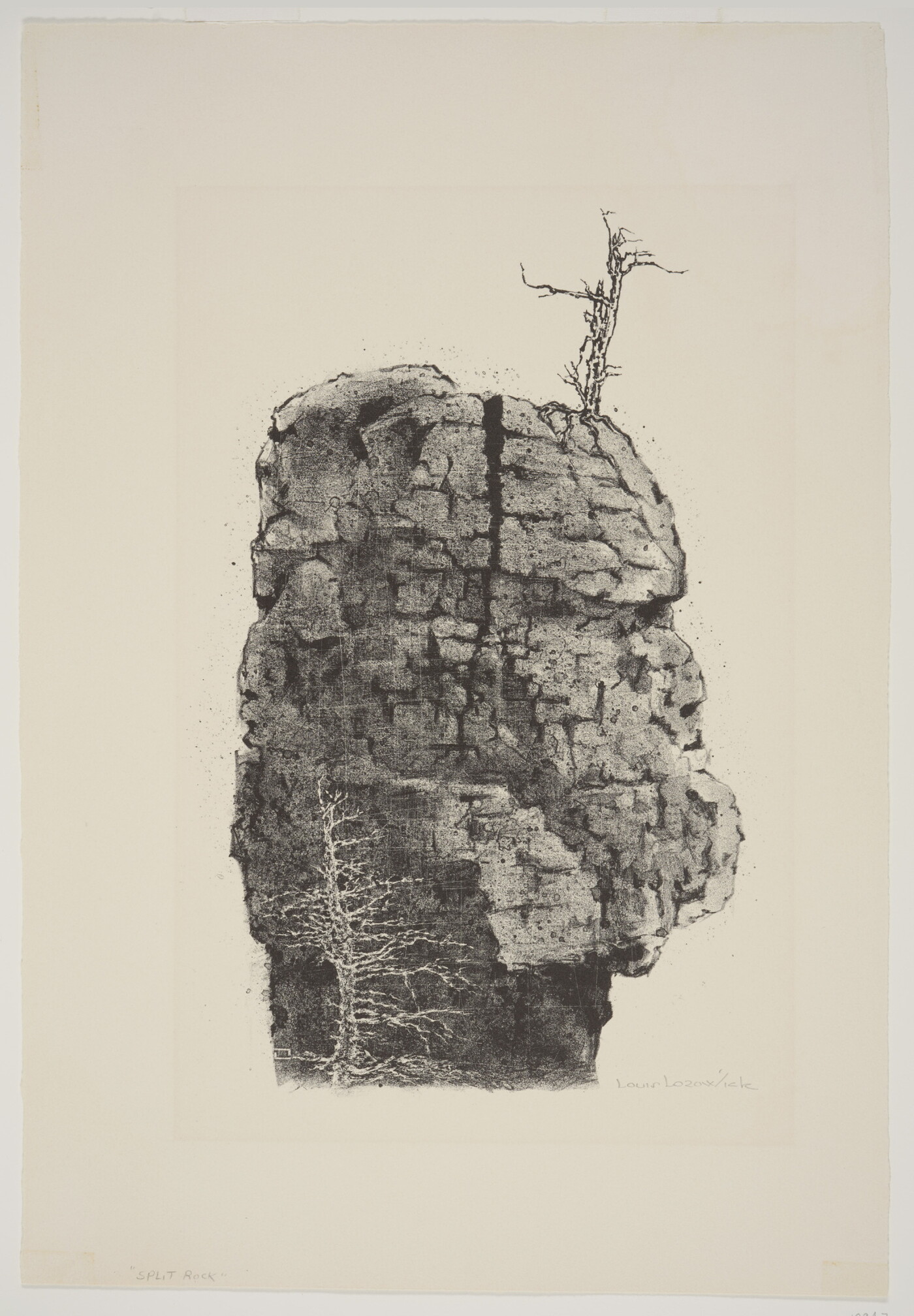 A black-and-white print of a large boulder with a vertical crack in the middle and a leafless tree on the top.
