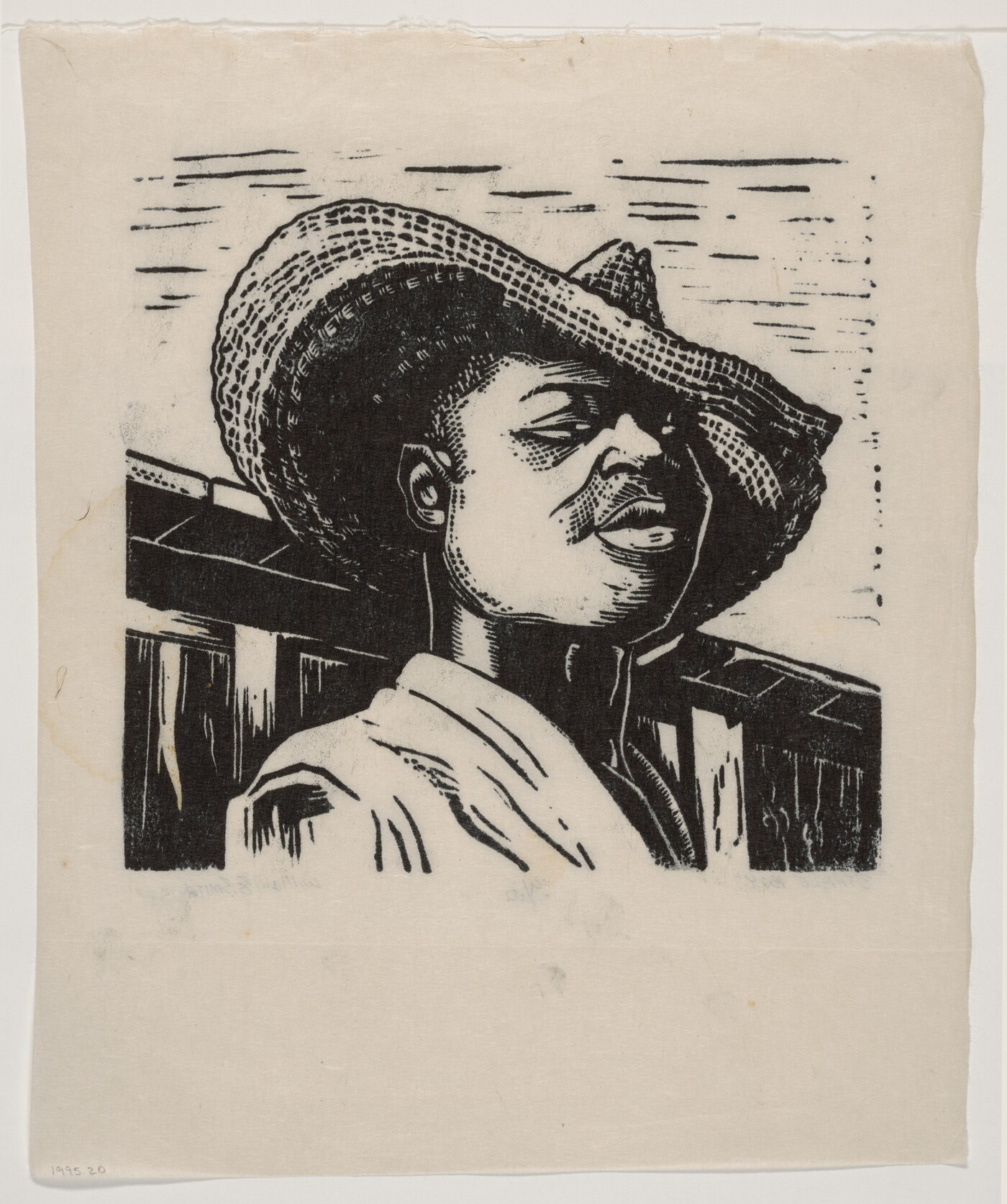 A black-and-white print of a Black boy, from the shoulders up, wearing a straw hat pulled slightly over one eye.
