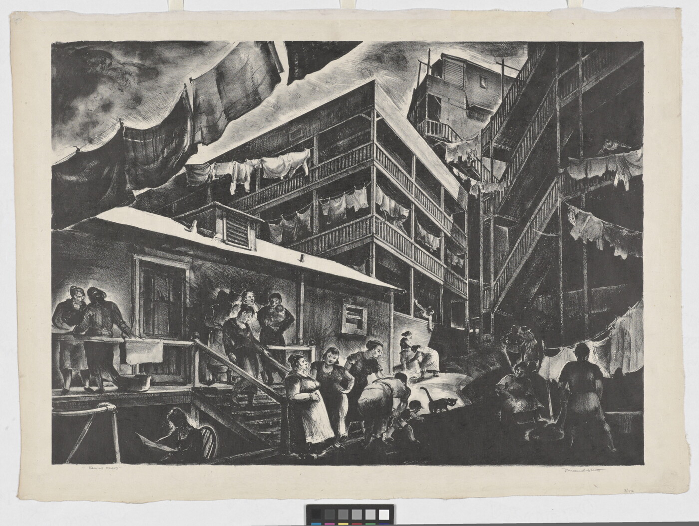A black-and-white cityscape print of people talking and working in front of tenement housing with laundry hanging on lines between buildings.