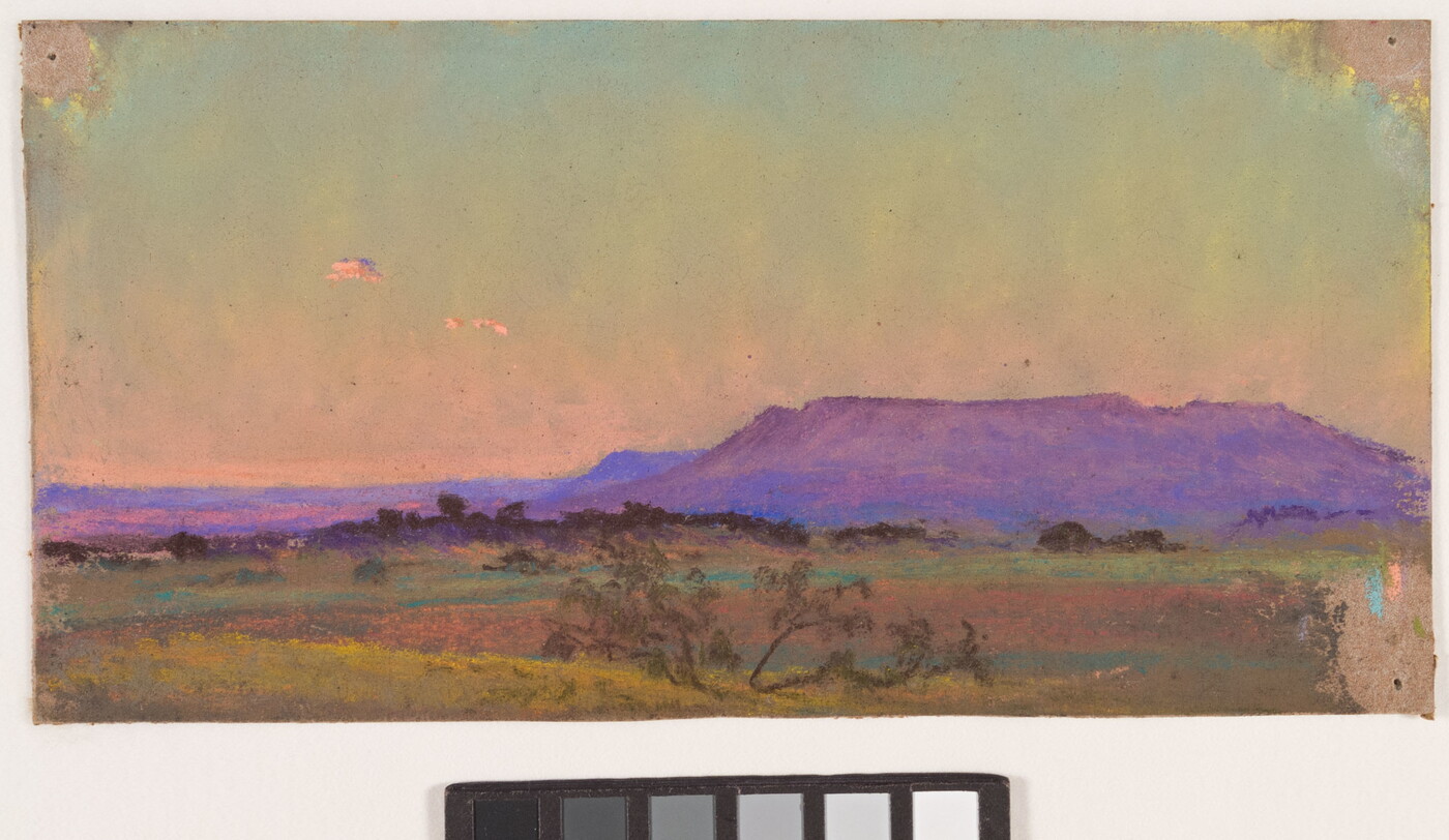 A colorful pastel drawing of a large field, with a purple mesa in the distance during sunrise or sunset.