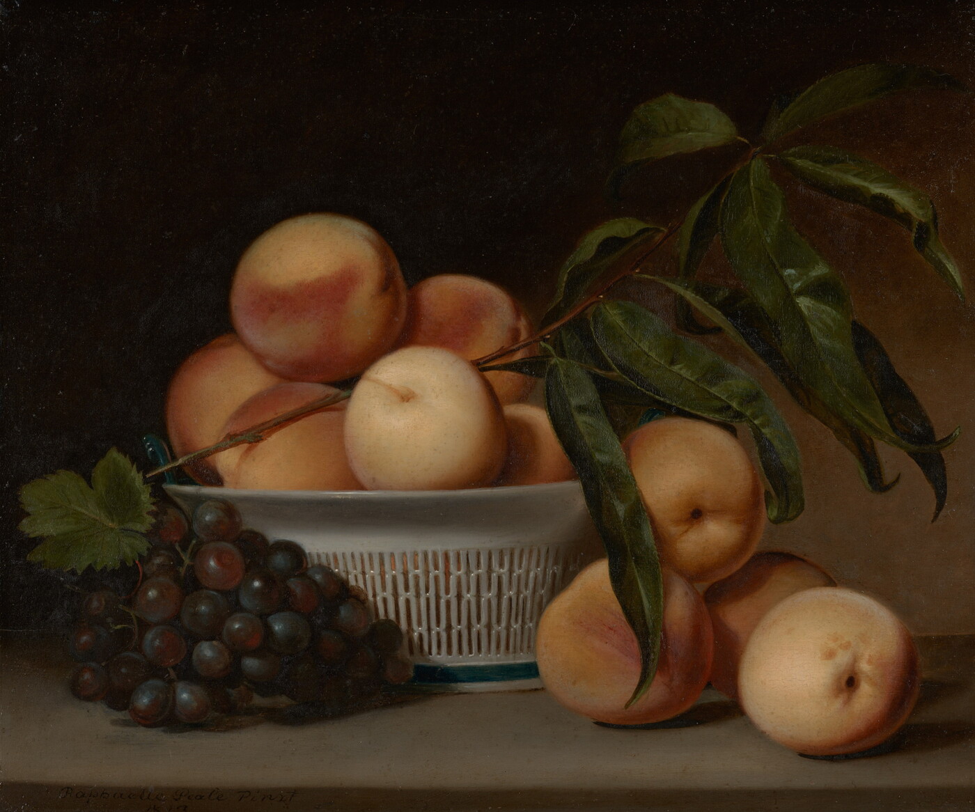 A still life oil painting of a cluster of purple grapes and several peaches next to a white, porcelain basket holding more peaches.