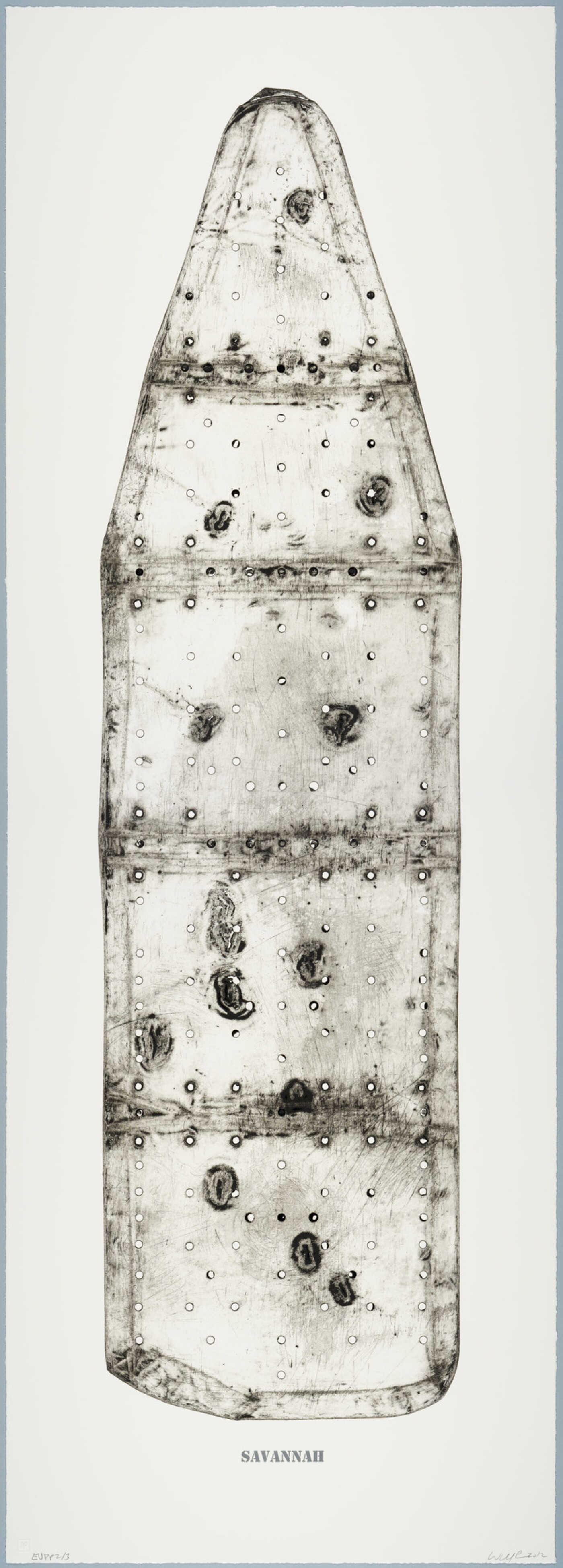 A black-and-white print of an ironing board filled with holes and dents, showing the shadows of its supporting structure, and with the word &quot;SAVANNAH&quot; below the image.