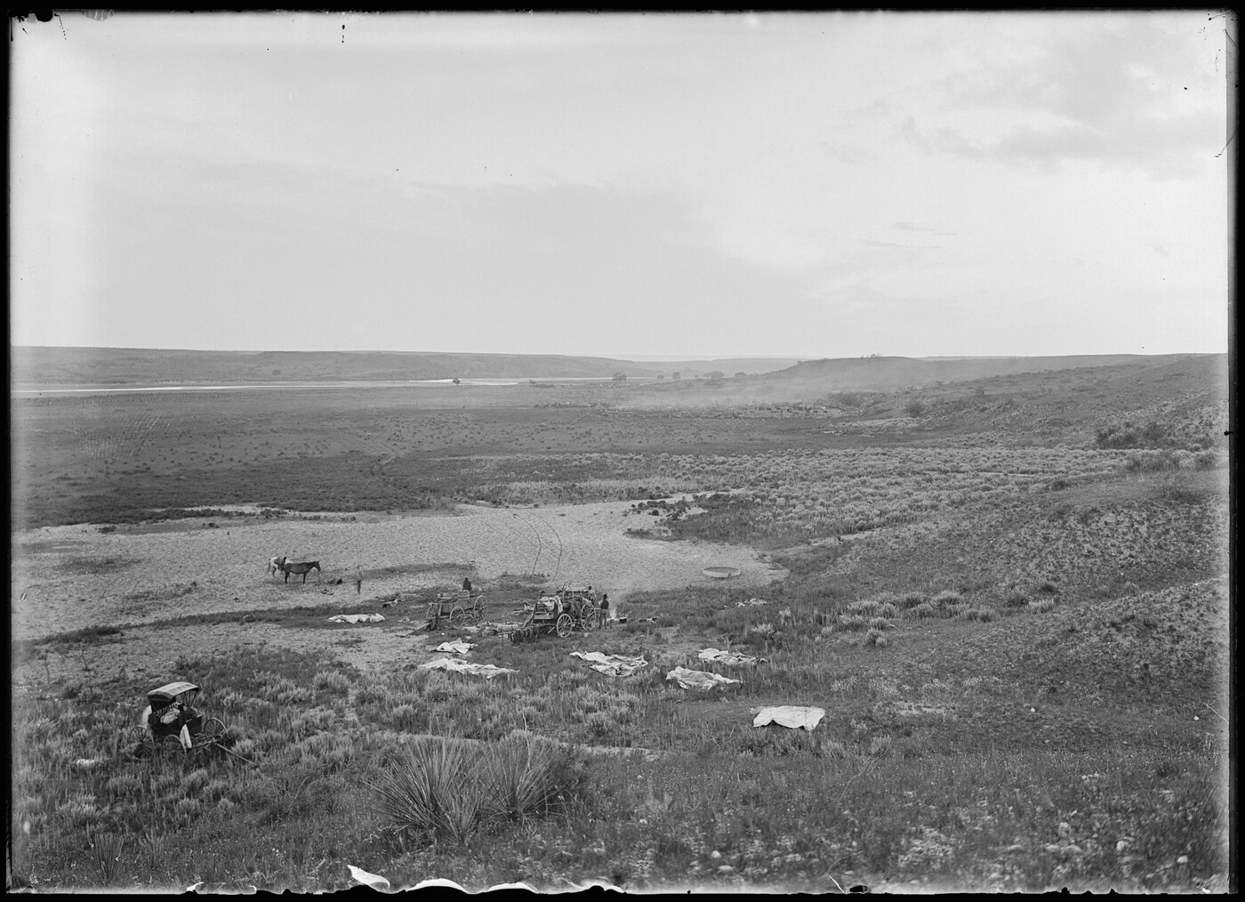 Looking down into the valley on a chuck wagon and hoodlum wagon of the