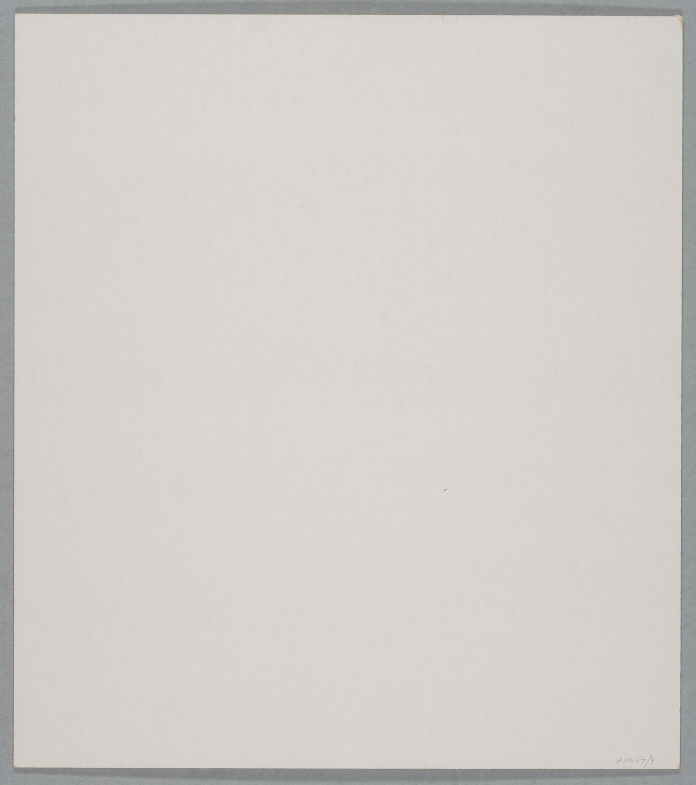 A black-and-white close-up photograph of a white rock with dark lines and cracks running through it.