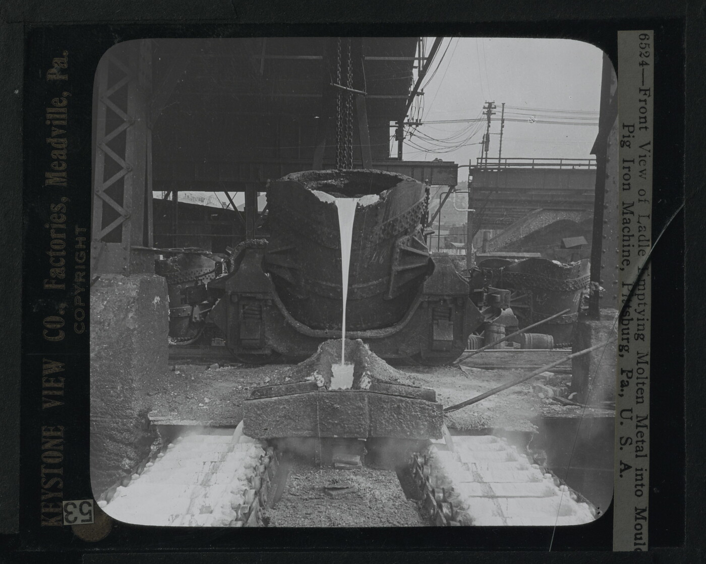 Front View of Ladle Empyting Molten Metal into Moulds, Pig Iron Machine