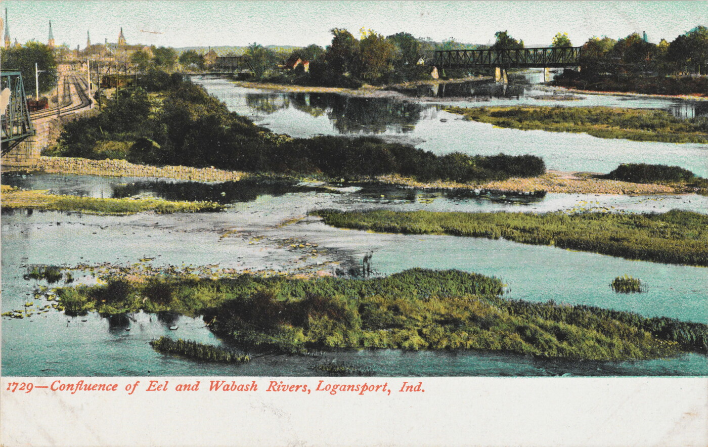 A color postcard of a marshy area dotted with little wooded islands, several bridges over the water, and train tracks off to the side.