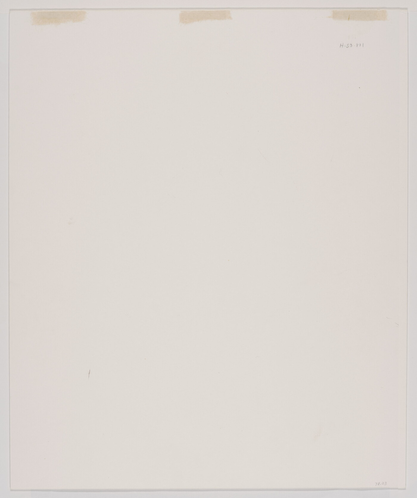 A black-and-white portrait of an older, balding White man wearing jeans and a long-sleeve button-down shirt leaning against a wooden beam.