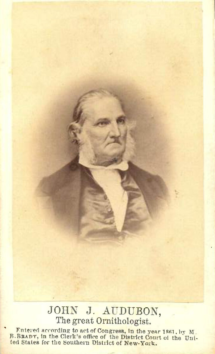 A sepia-toned photograph of the head and shoulders of a balding, middle-aged White man with large sideburns.