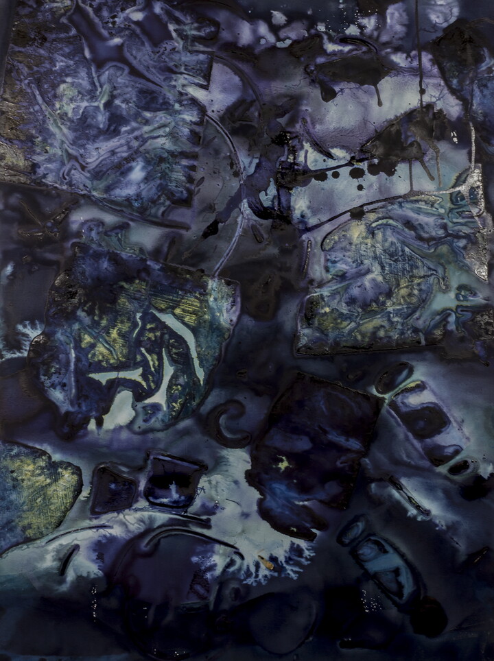 An abstract photograph in dark blues and greens.