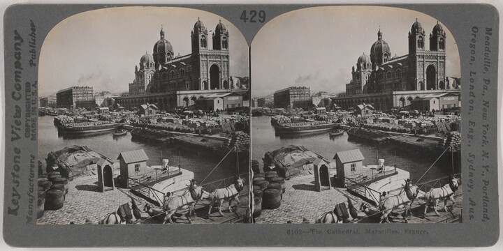 Two almost identical black-and-white photographs side by side of a large cathedral next to a river with boats docked nearby.