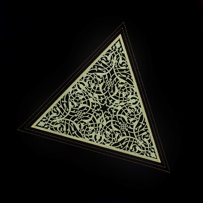 A light gray-green triangle with an intricate design cut into it stitched onto black paper.