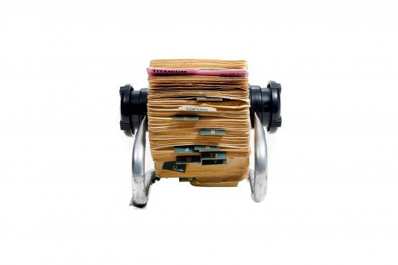 A rolodex of manilla-colored cards.