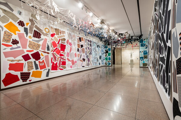 A Carter gallery with the walls and ceiling covered with cut up pieces of clothing.