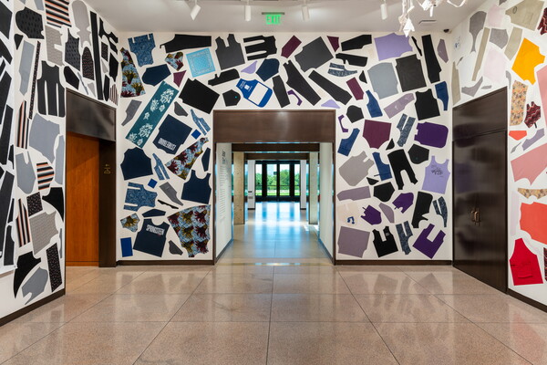 A Carter gallery with the walls and ceiling covered with cut up pieces of clothing.