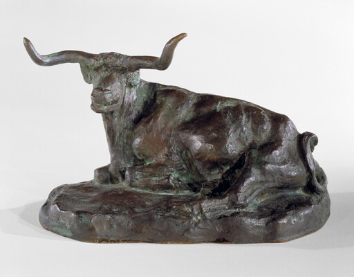 A bronze sculpture of a longhorn steer resting on the ground.