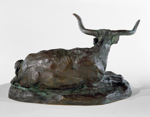 A bronze sculpture of a longhorn steer resting on the ground.