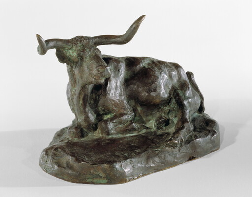 A bronze sculpture of a longhorn steer resting on the ground.