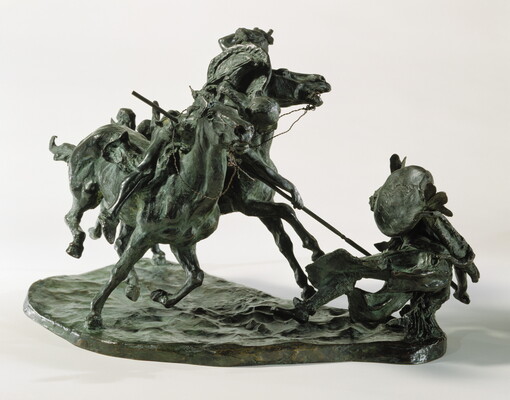 A bronze sculpture of two horses in mid-gallop, with both riders lunging toward a crouching man behind a shield.