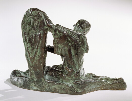 A bronze sculpture of a Native American woman looking at a child propped upright in a cradleboard.