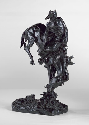 A bronze sculpture of a cowboy hanging onto a bucking bronco.