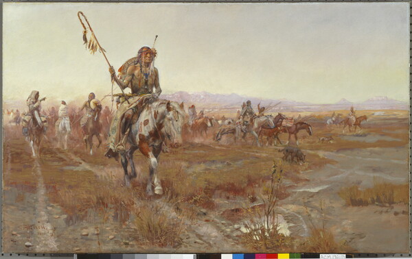 A Native American man wearing elaborate clothing leads a group on horseback through the plains.
