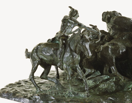 A detail of a bronze sculpture of two Native men, one with a spear and the other with a bow, on horseback circling a group of bison.