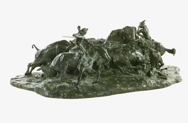 A bronze sculpture of two Native men, one with a spear and the other with a bow, on horseback circling a group of bison.