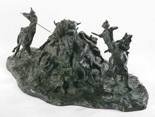 A bronze sculpture of two Native men, one with a spear and the other with a bow, on horseback circling a group of bison.