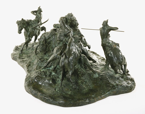 A bronze sculpture of two Native men, one with a spear and the other with a bow, on horseback circling a group of bison.