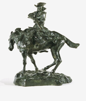 A bronze sculpture of a man on horseback pointing a long rifle.