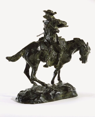 A bronze sculpture of a man on horseback pointing a long rifle.