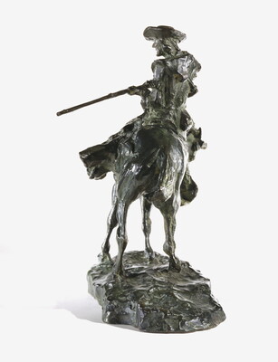 A bronze sculpture of a man on horseback pointing a long rifle.