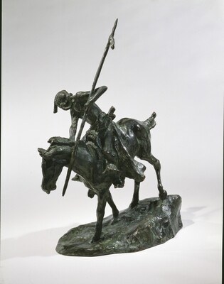 A bronze sculpture of an Indigenous man on horseback holding a spear pointed toward the ground as he studies footprints there.