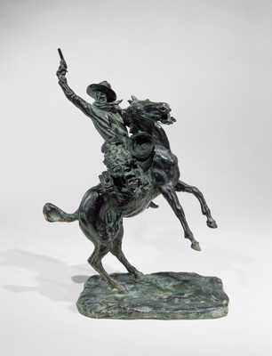 A bronze sculpture of a man pointing a gun up high over his head while on a rearing horse.