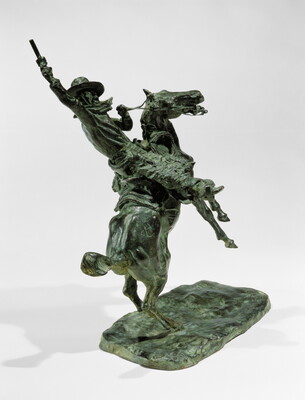 A bronze sculpture of a man pointing a gun up high over his head while on a rearing horse.