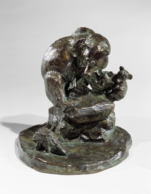A bronze sculpture of a mother bear and her two cubs huddled on a rock as a porcupine walks past.