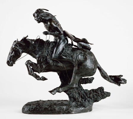 A bronze sculpture of an Indigenous man riding a running horse.