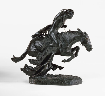 A bronze sculpture of an Indigenous man riding a running horse.