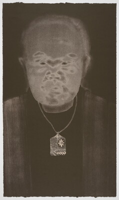 A black-and-white print of an abstracted man with Asian features, a gray face, and wearing a delicately patterned necklace all on a black background.