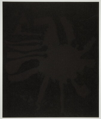 An abstract color print of a very dark brown splatter shape against a black background.