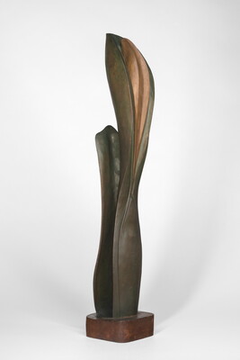 A wood sculpture of a tall, thin leaf with two smaller leaves on either side.