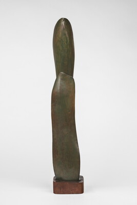 A wood sculpture of a tall, thin leaf with two smaller leaves on either side.