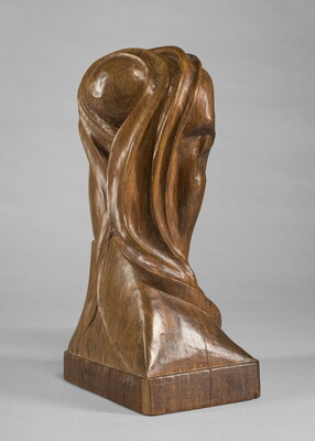A mahogany sculpture representing an abstracted head.