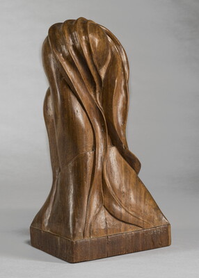 A mahogany sculpture representing an abstracted head.
