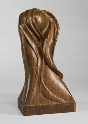 A mahogany sculpture representing an abstracted head.