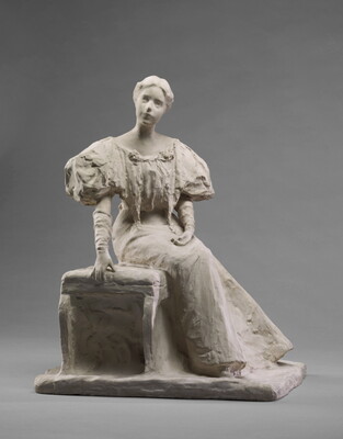 A white, plaster sculpture of a young woman sitting on a bench in a long dress with puffy sleeves.