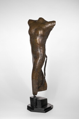 A copper sculpture of a nude female figure with no head, arms, or feet.