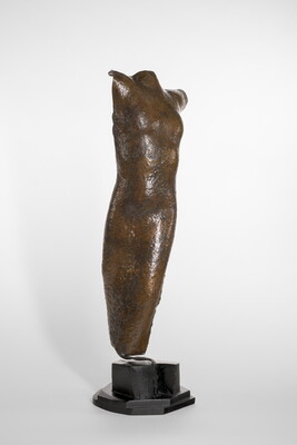 A copper sculpture of a nude female figure with no head, arms, or feet.